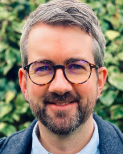 Dr Chris James